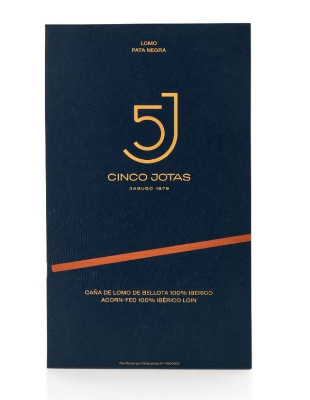 Cinco Jotas packaging with logo and text on a dark blue background